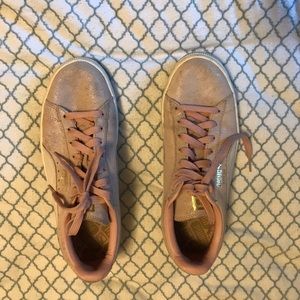 Pink suede pumas